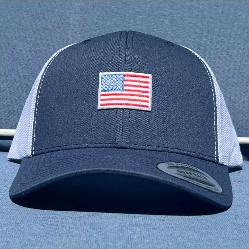 Navy and white trucker hat with Small American flag patch