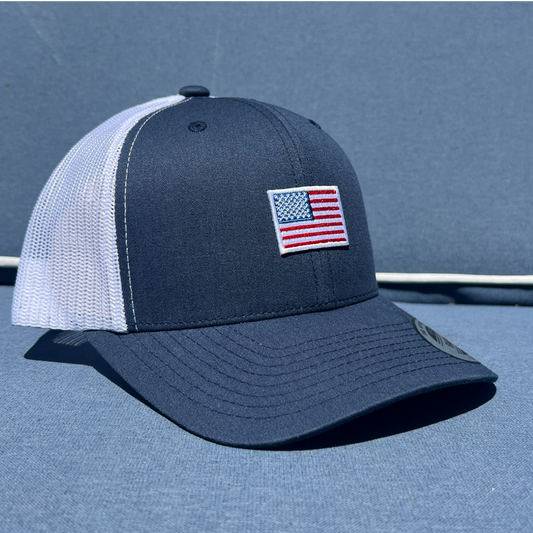 Navy and white trucker cap with Small American flag patch 