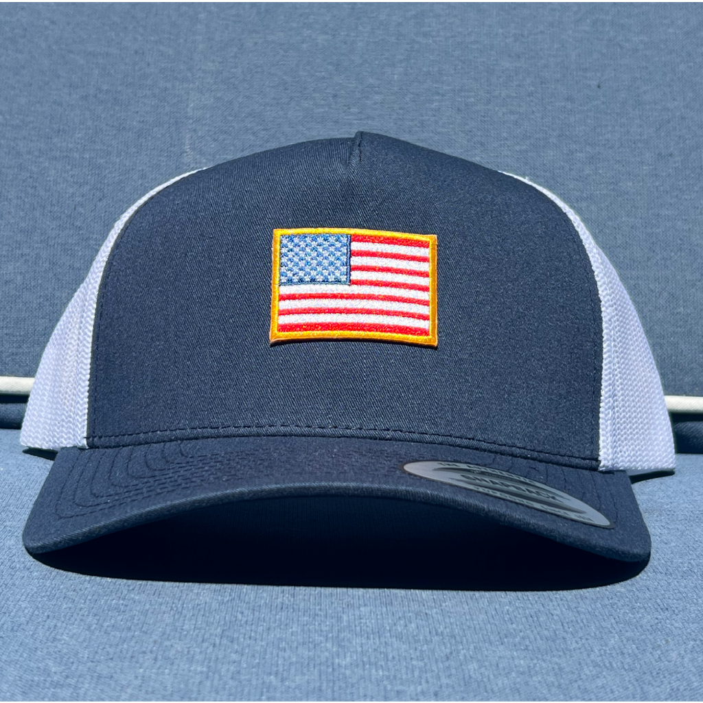 Navy and White trucker hat with American flag patch with gold border