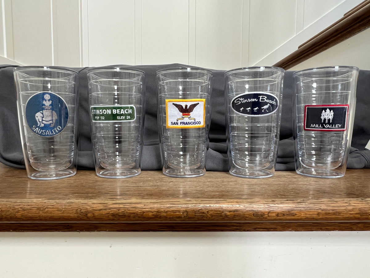 Five clear plastic tumblers with custom printed patches Sausalito, Stinson Beach, San Francisco, Mill Valley designed for locals to celebrate their town