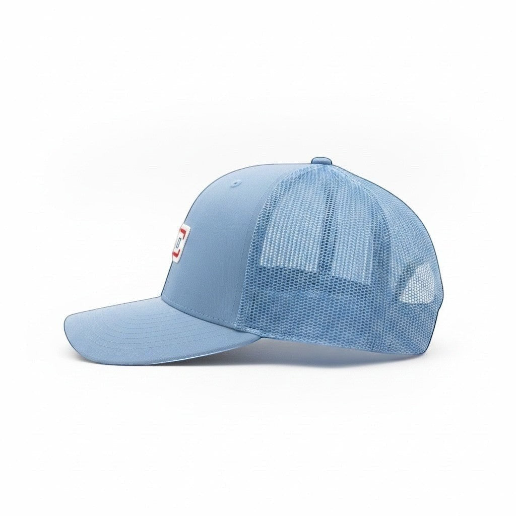 Stinson beach trucker hat in carolina blue with orange and white surfboard patch side view