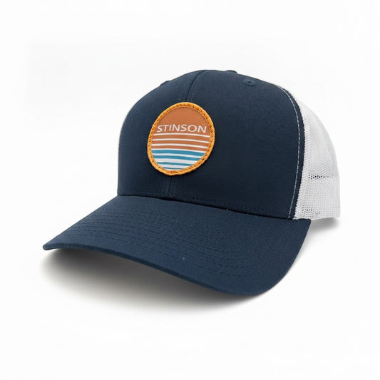 Lowkey Local Stinson Sunset trucker hat in navy and white with a circular stitched patch on the front